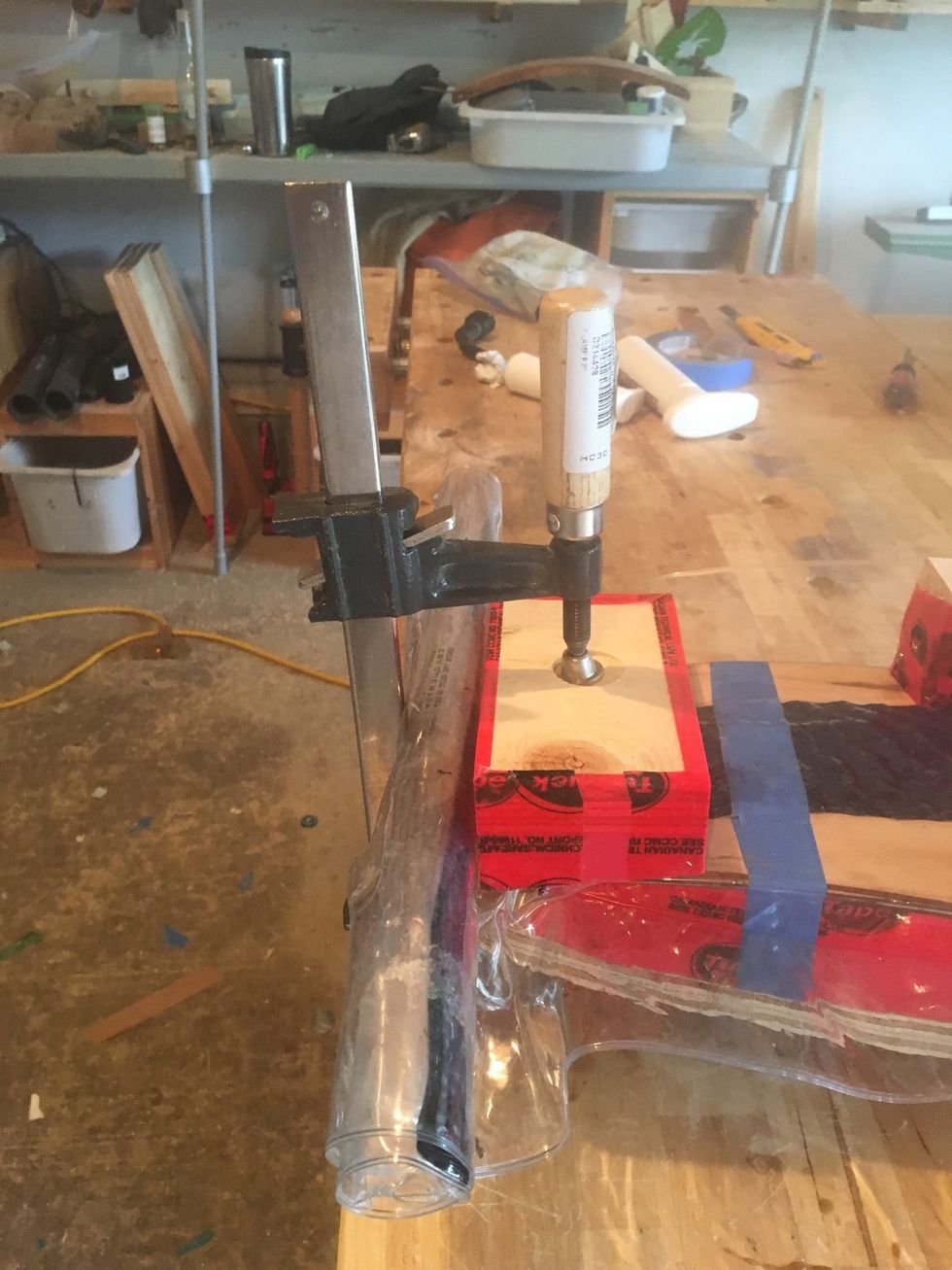 Clamp tail caul as depicted.