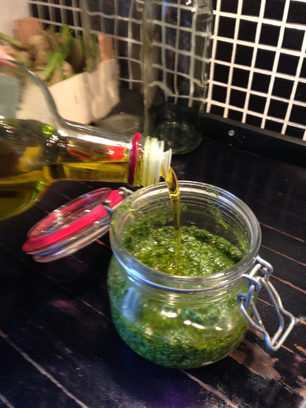 Clean a glass and add the pesto - remember to add a small layer of olive oil on top before closing the glass
