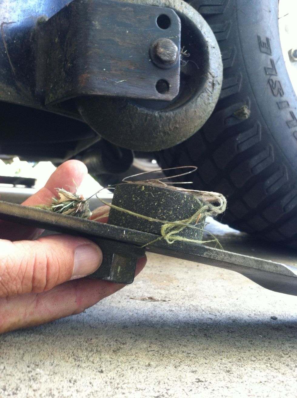 clean any junk wound around blades and spindle. NOTE the locations of spacers and washers, take a picture if you may forget, they GOTTA go back the same way. note which side of the blade is UP