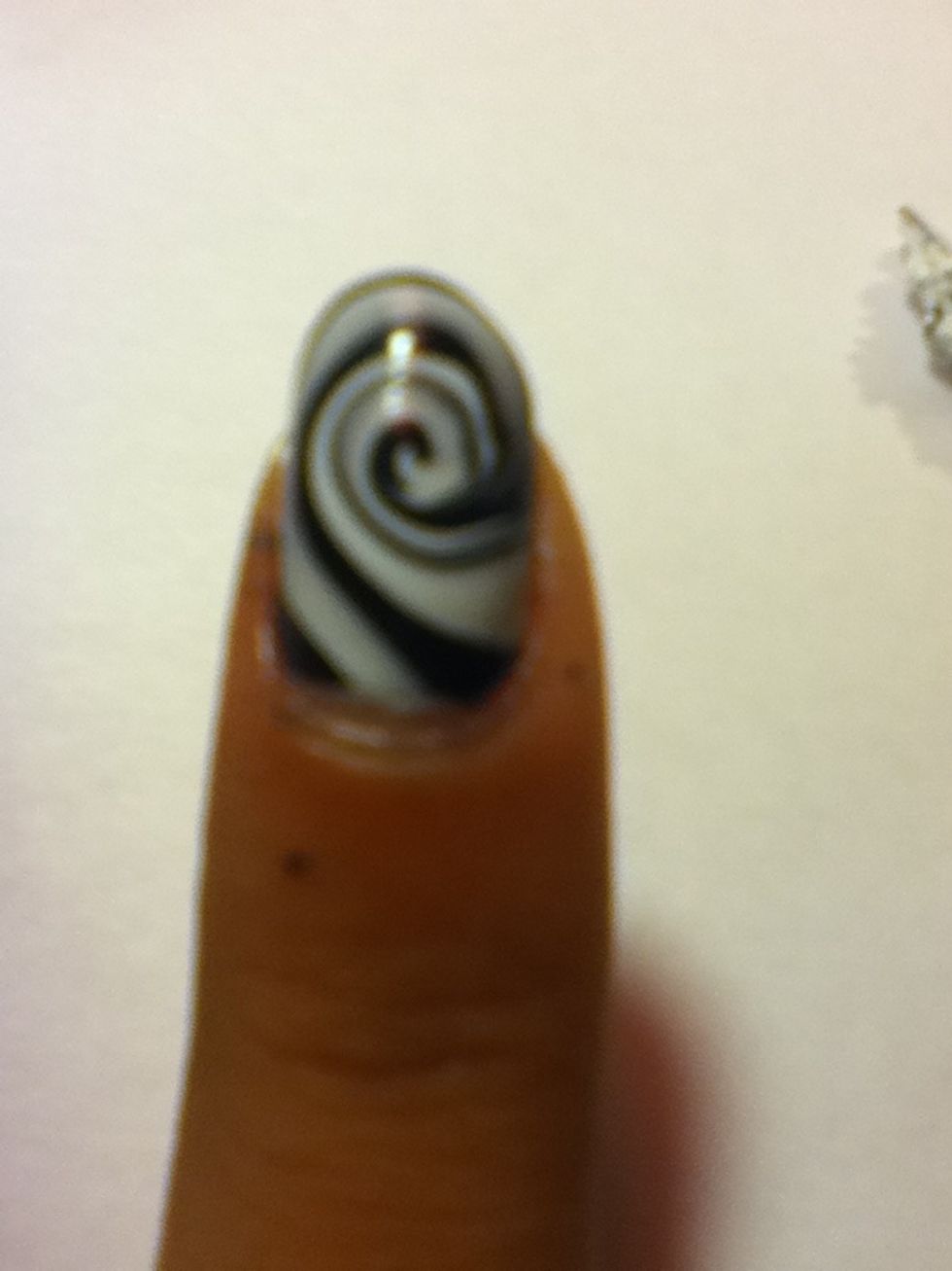 Clean any remaining polish with a Q-tip and nail polish remover :)