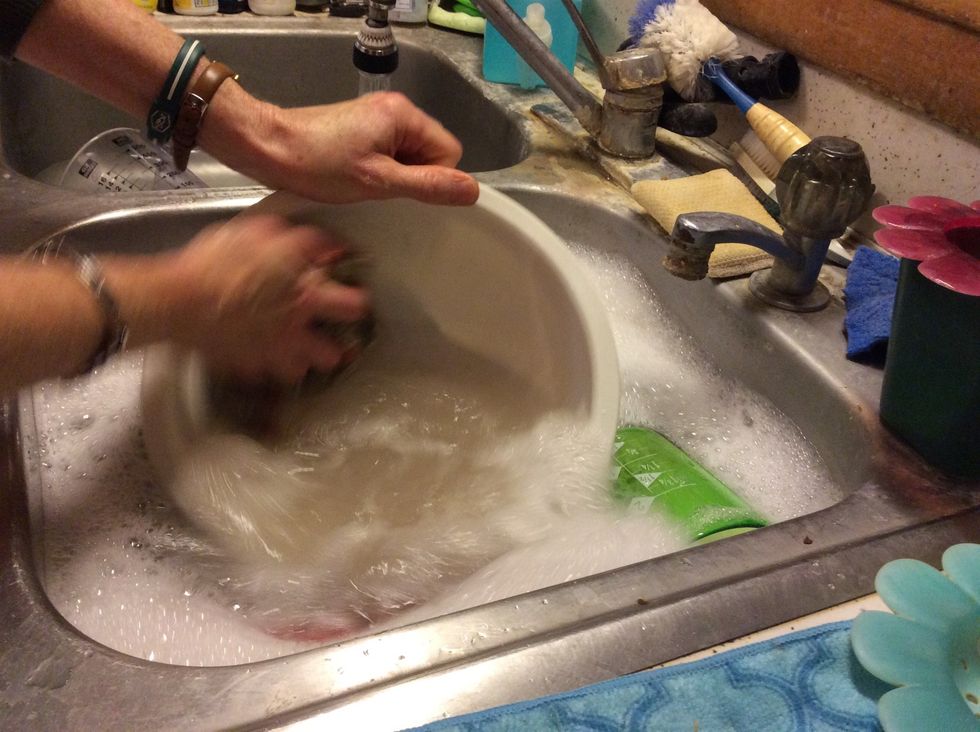 Clean cake utensils and bowl while waiting