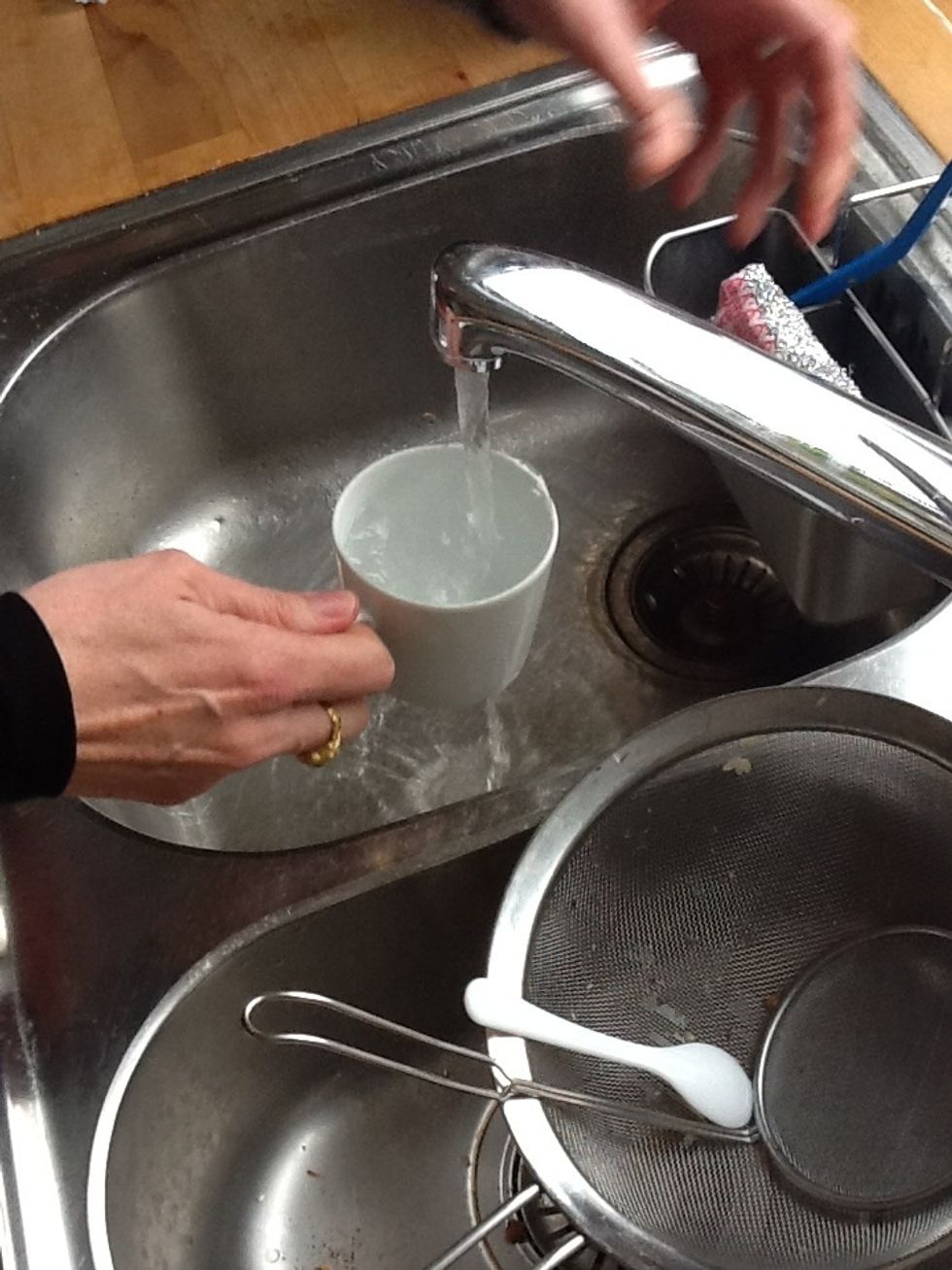 Clean cups and fill with hot water