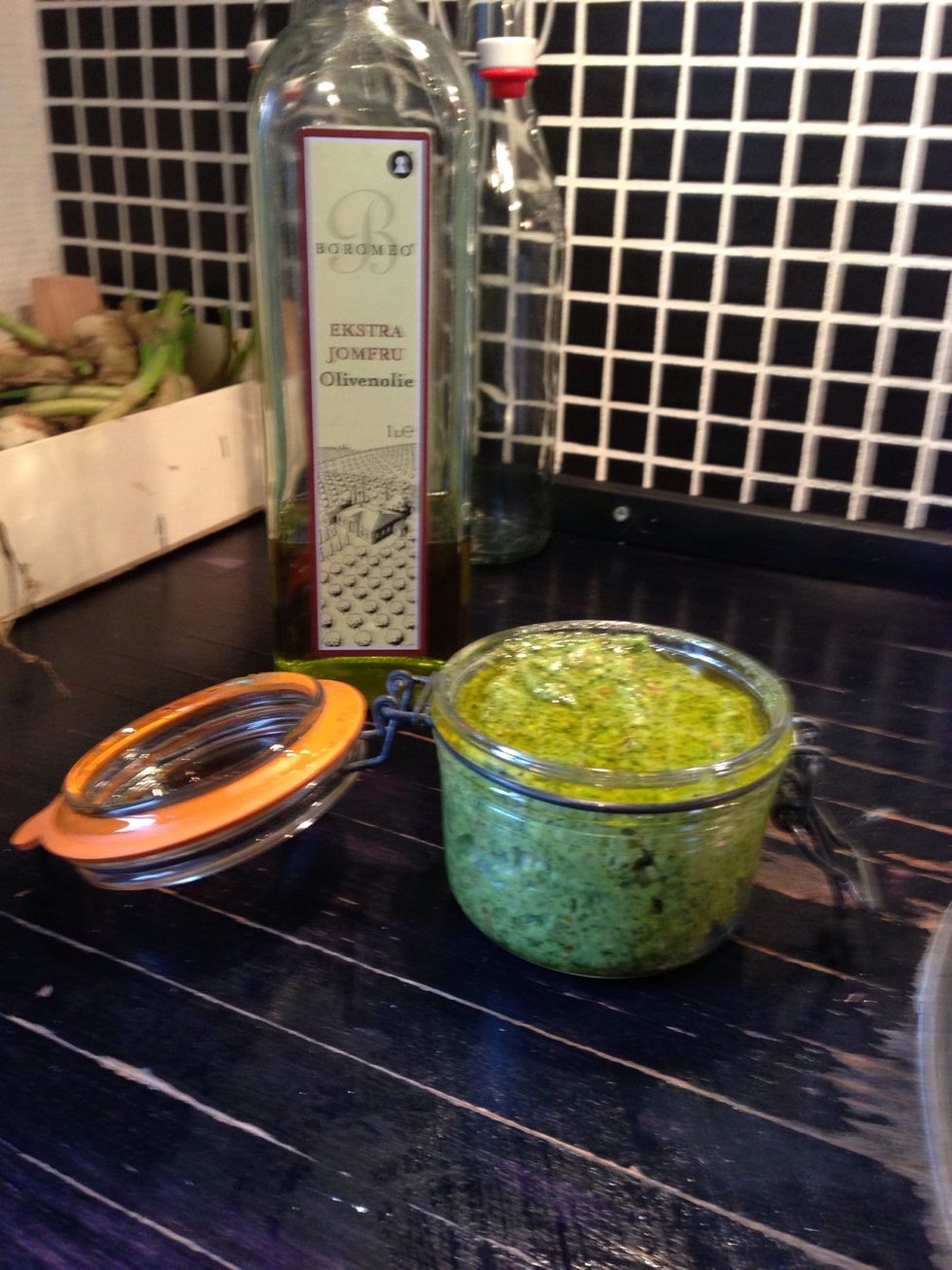 Clean glass and add the pesto and add oil on top