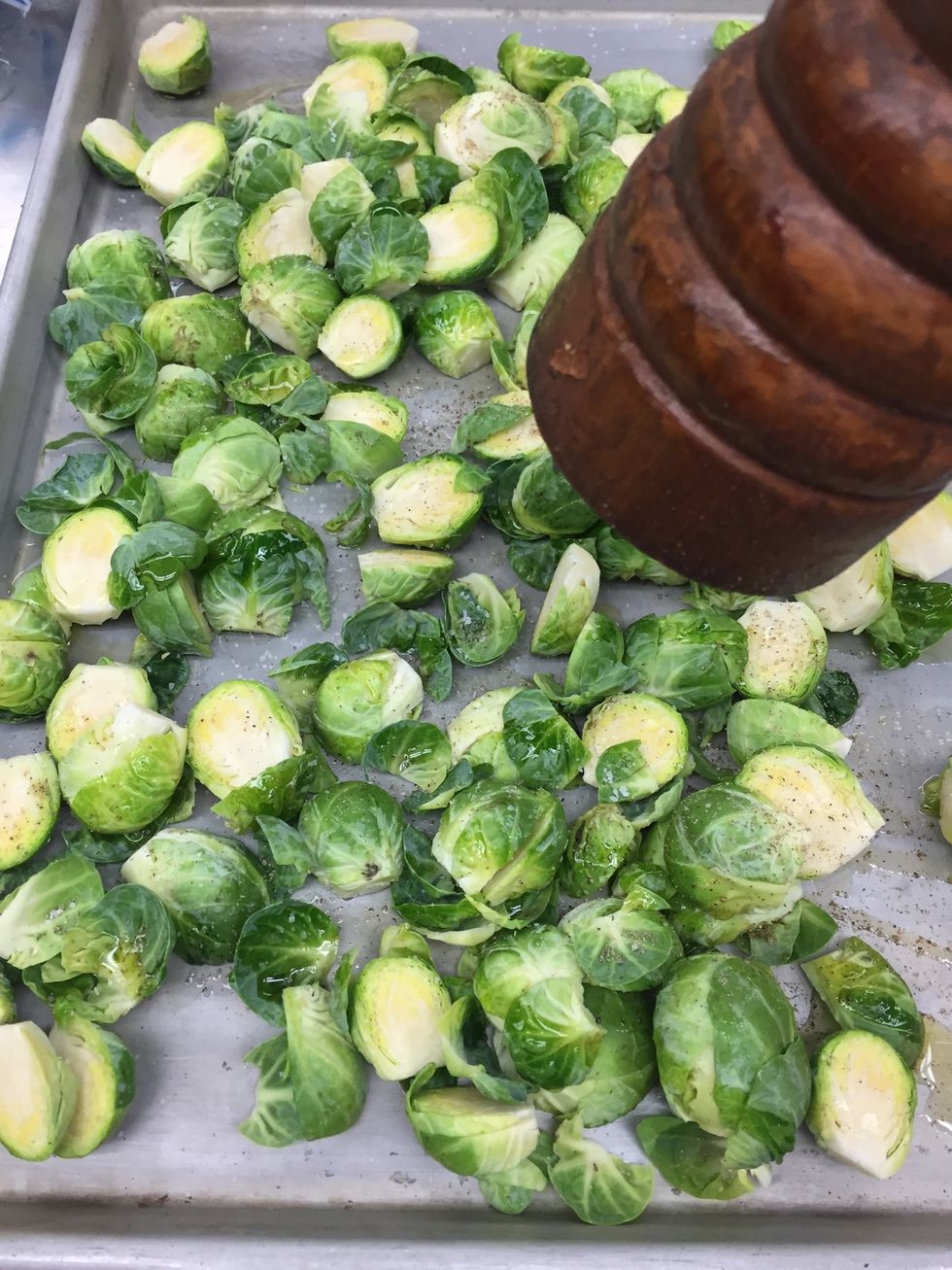 Clean/half sprouts then salt & pepper onto the sheet tray.