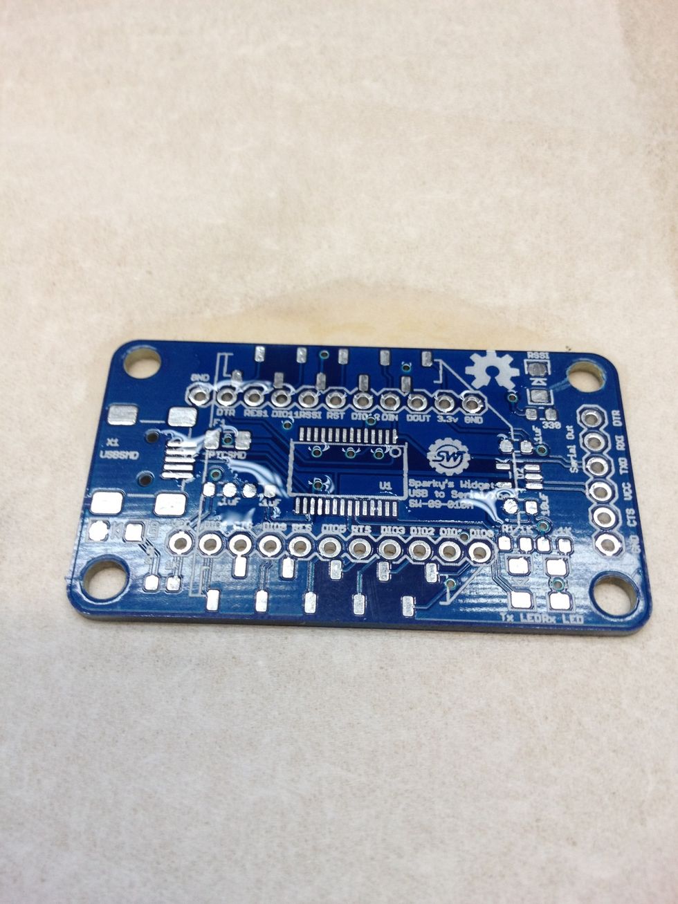 Clean off PCB with rubbing alcohol and a lint free cloth(kimwipes for example). We don't want any dirt getting in the way.