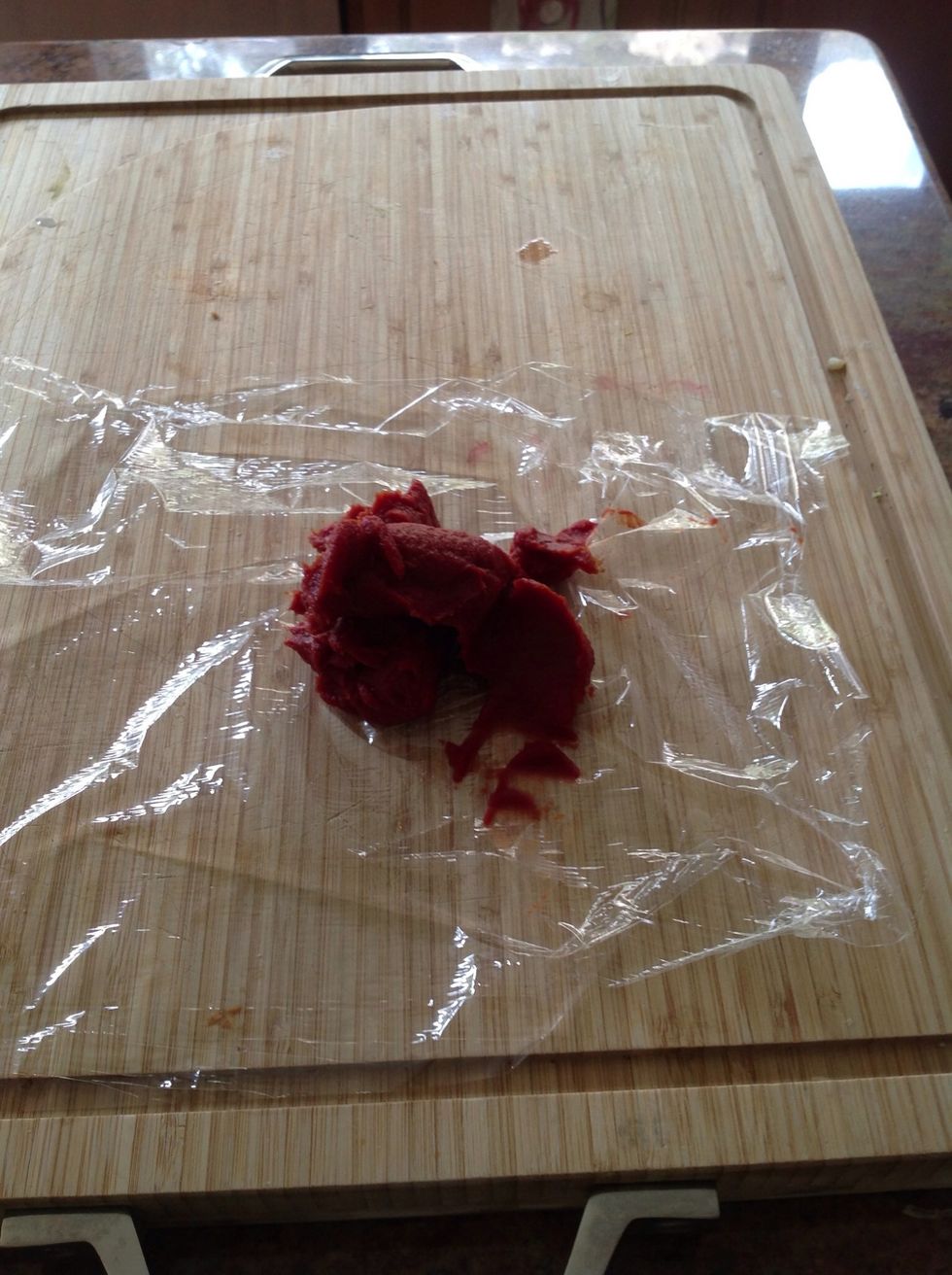 Clean paste out of can and put it on cling wrap.
