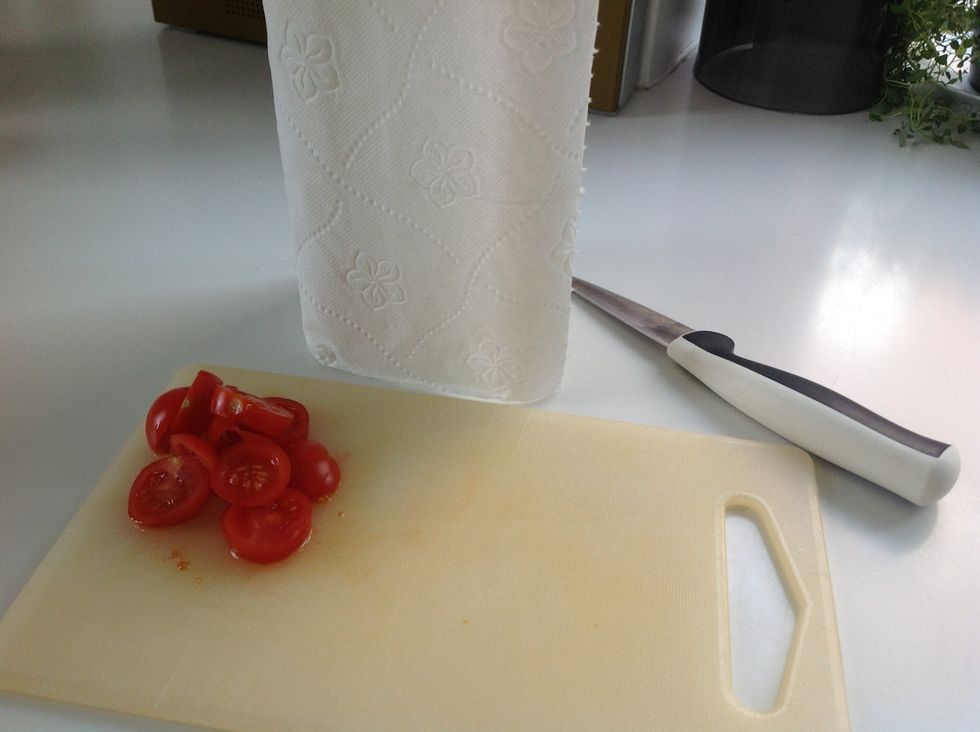 Clean the chopping board with a towel