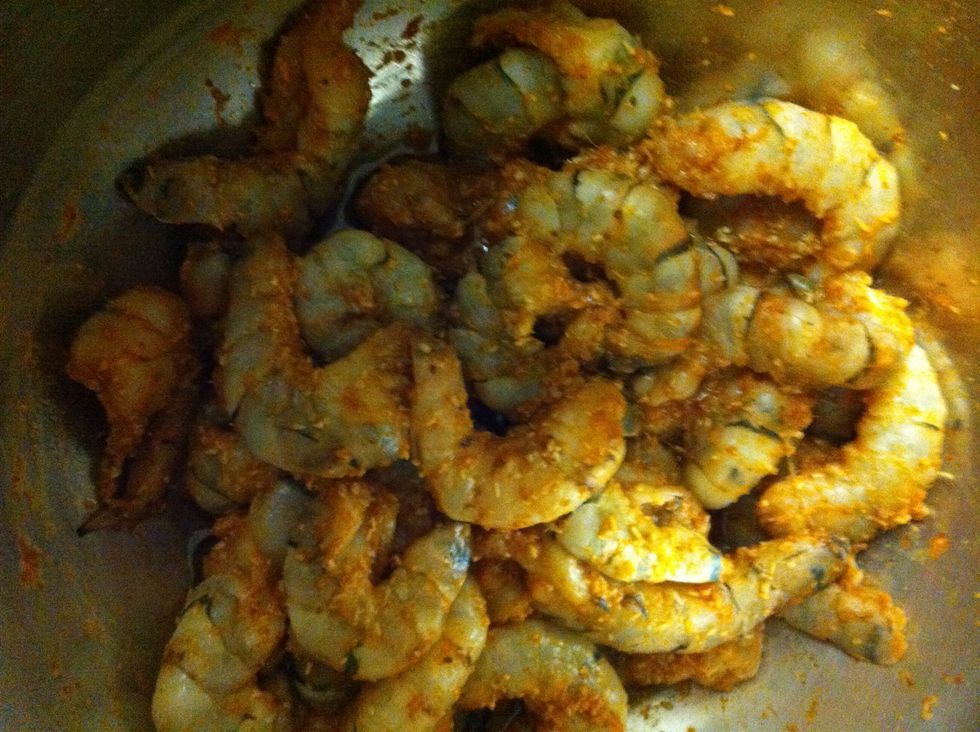 Clean the shrimps and double clean with salt and rinse it off well. Here I marinated with ginger garlic paste,red chilly powder,coriander and cumin powder, coconut powder. And set aside.