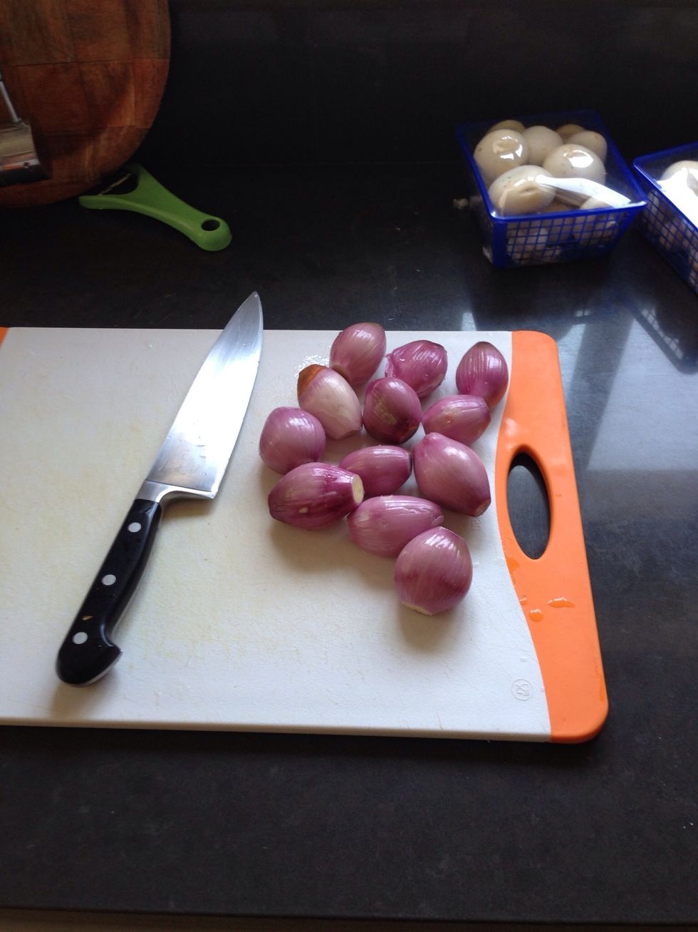 Clean the skin off the shallots..