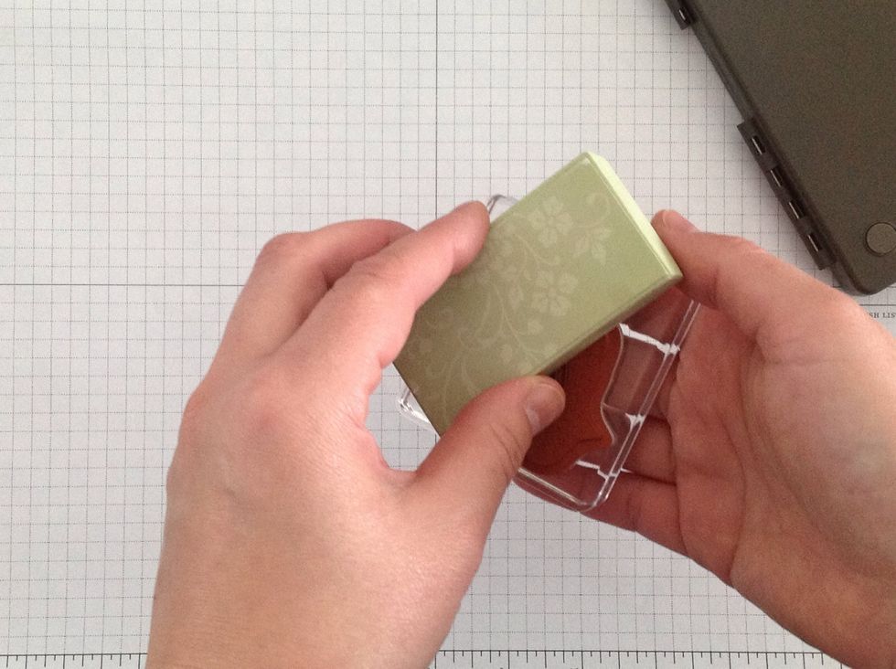 Clean the stamp to get rid of the ink, then, using the striped side of the Sanding Block, VERY LIGHTLY sand the stamp. It will turn light orange again. Use a light touch, and you won't ruin the stamp.