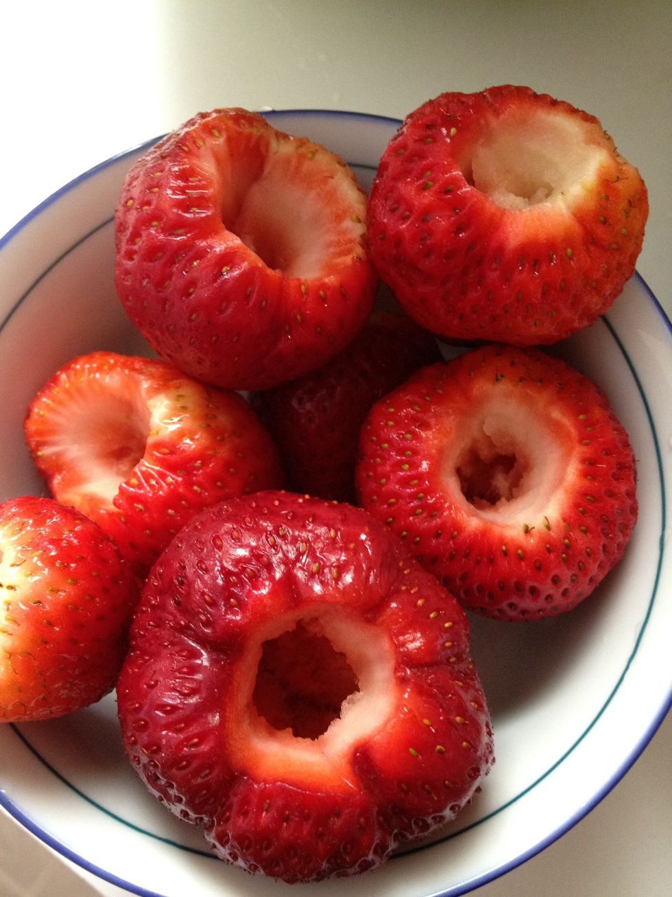 Clean the strawberries & cut out the core.