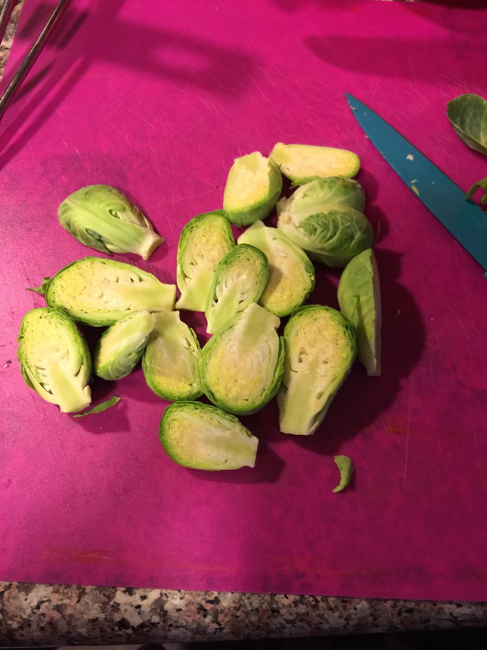 Clean them by cutting the end and removing the outmost leaves which are hard. And i cut them into halves.