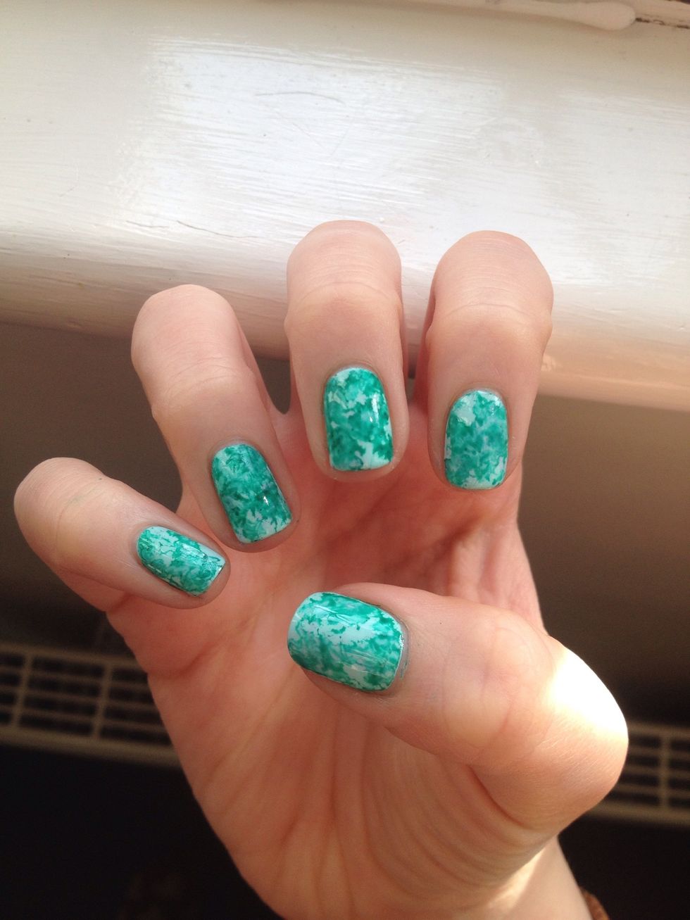 Clean up around the edges with nail polish remover and add a top coat to make sure the paint stays on and for extra shine!