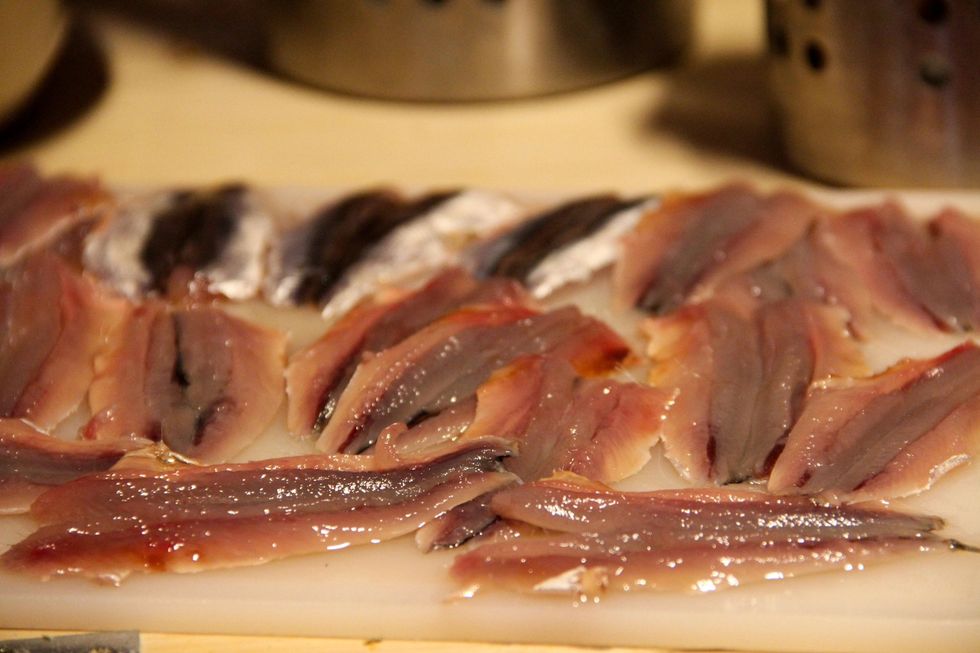 Clean you anchovies and flatten out