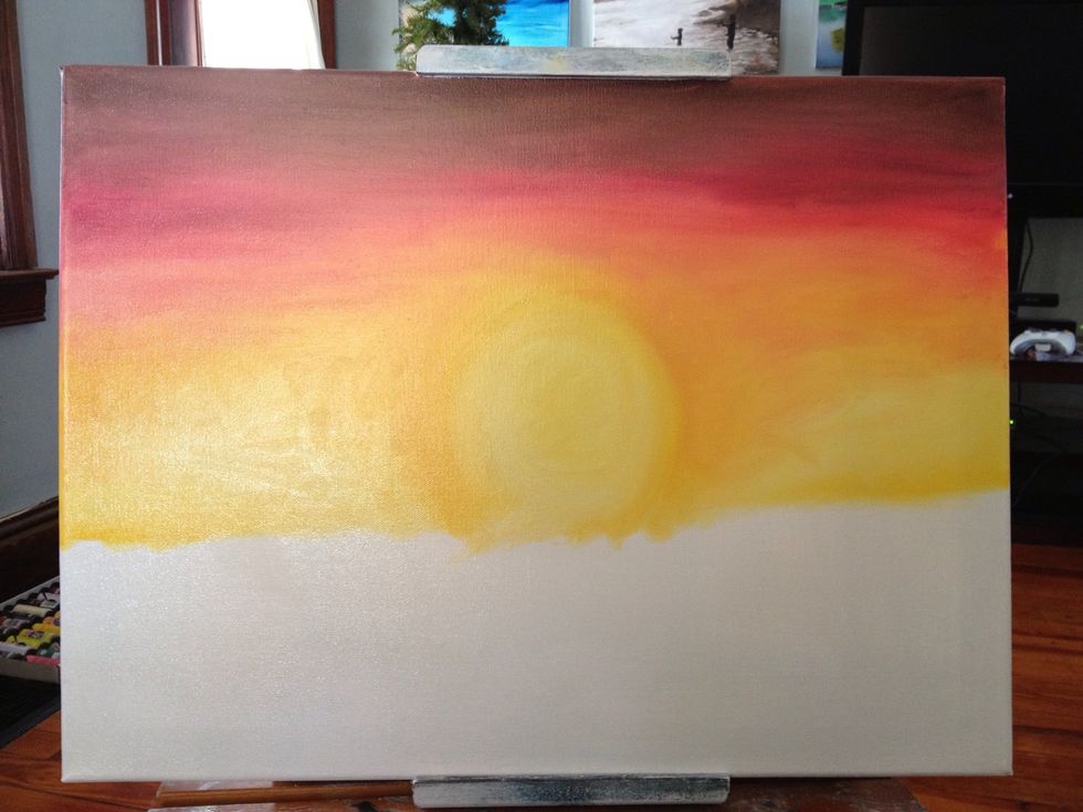 Clean your hand and lightly blend all the colors starting bright and working your way up to the dark sky.