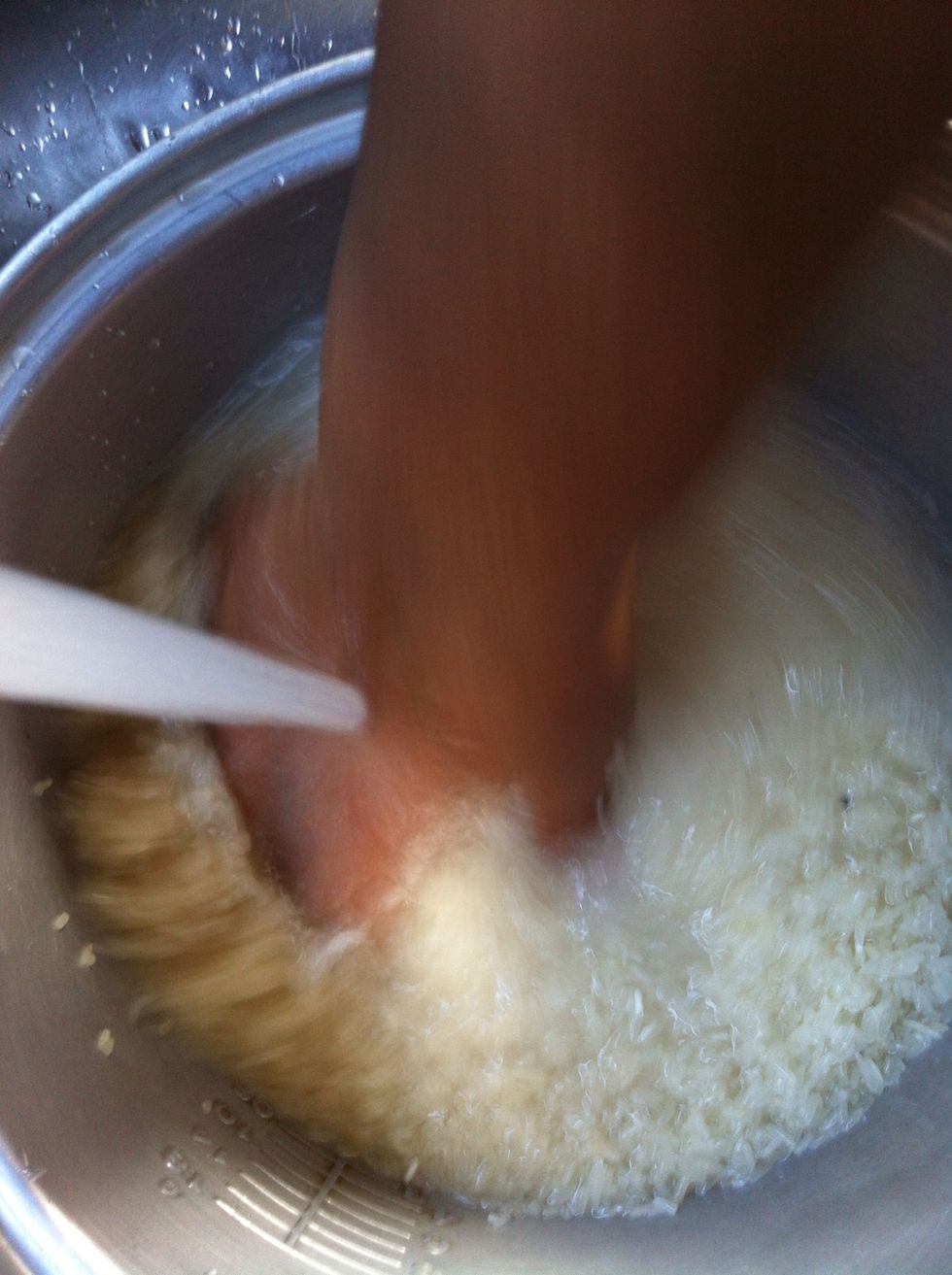 Cleaning rice with water.