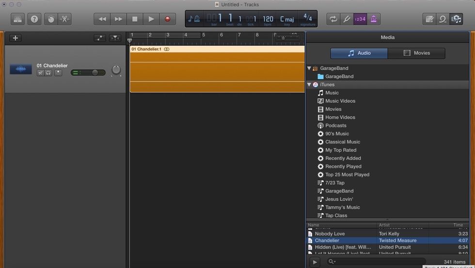 Click and drag a song from your iTunes library song list to position one of the editing space.