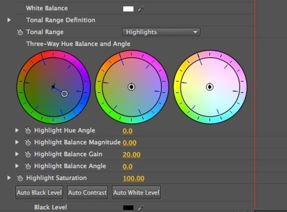 Click and hold the black circle in the middle of the Shadows wheel. Drag it towards the blue area of the colour wheel.