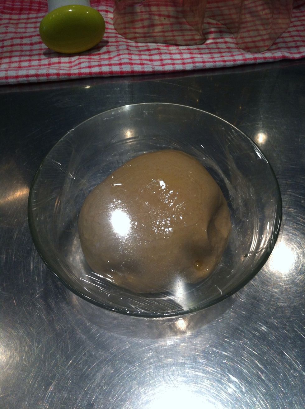 Cling film, leave in a warm place to rise. Just out in the kitchen is fine too.. The heat will depend on the speed of rising...