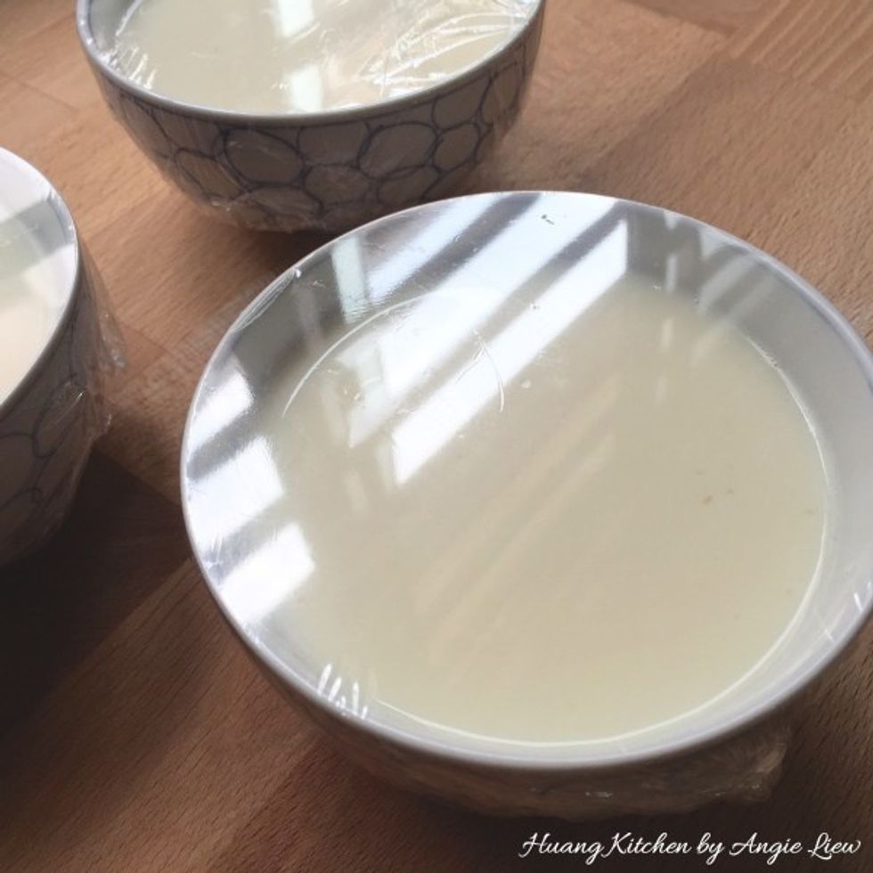 Cling wrap tightly each bowl of ginger milk mixture.