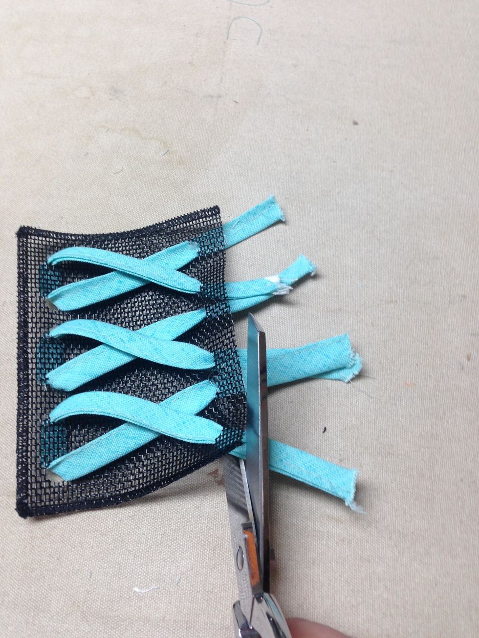 Clip strips even with the top of the pocket.  (You could stitch the strips in place along the top edge of the pocket but I didn't.