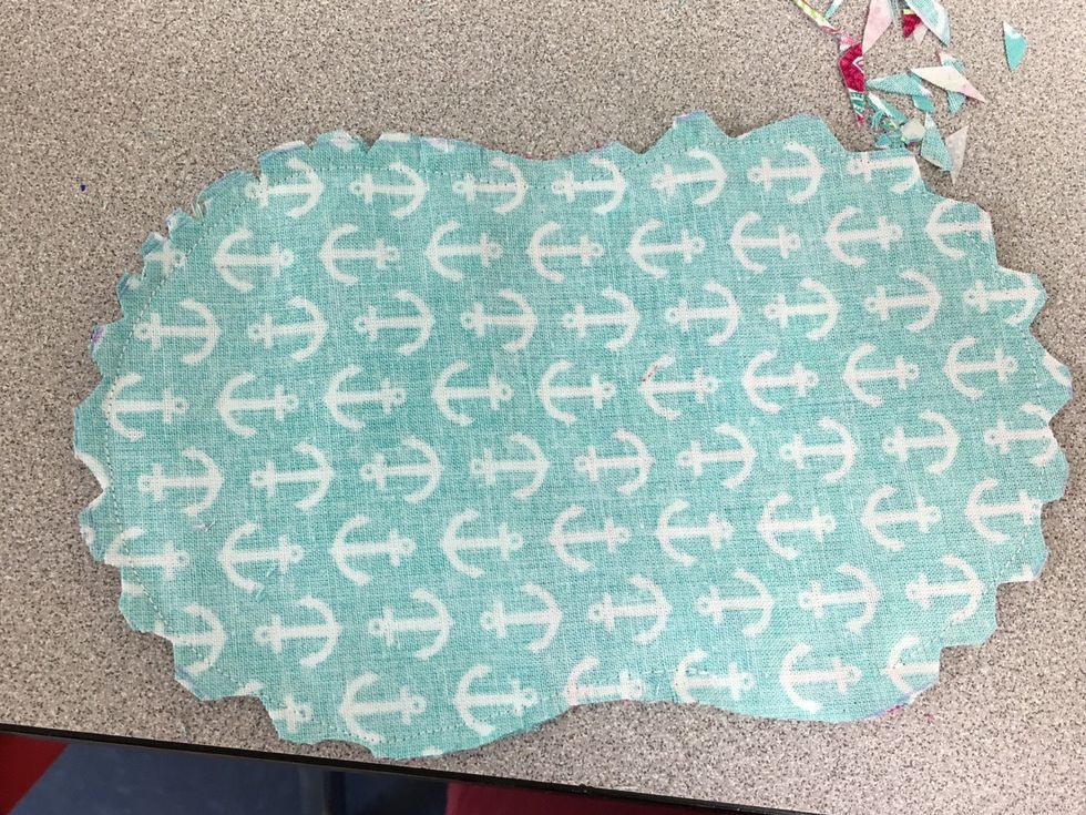 Clip the inner curves. And notch the outer curves. Careful not to cut through the stitching! If you do, repair before flipping right side out.