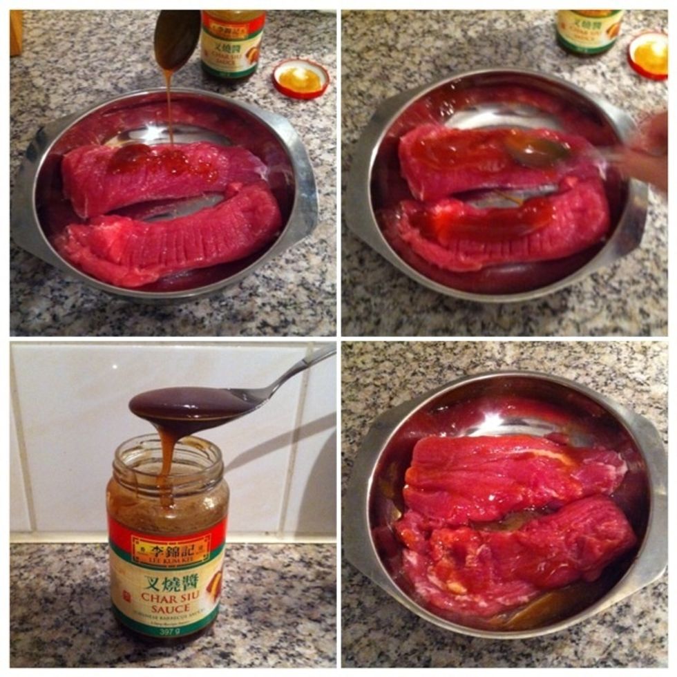 (clockwise) Drizzle 1tbsp char siu sauce on both pieces. Use your spoon to rub the sauce over/into the pork loin. Don't forget to repeat this to the other side!