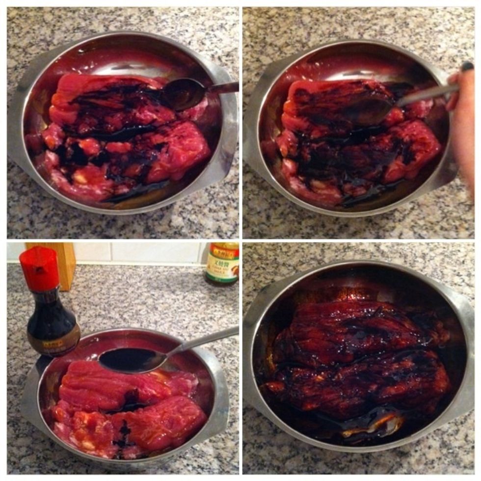 (clockwise) Spread 1tbsp dark soy sauce on both pieces. Use your spoon to rub the sauce over/into the pork. Don't forget to repeat this to the other side!