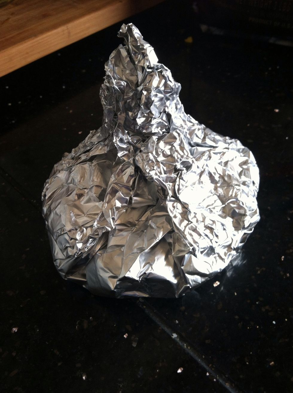Close foil around garlic and shape like a garlic bulb