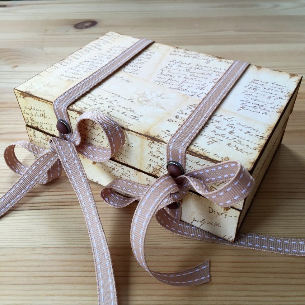 Close the box with a tie.