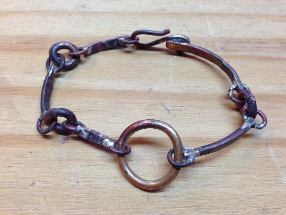 Close the connector jump rings when they are where you want them, as in step 19.