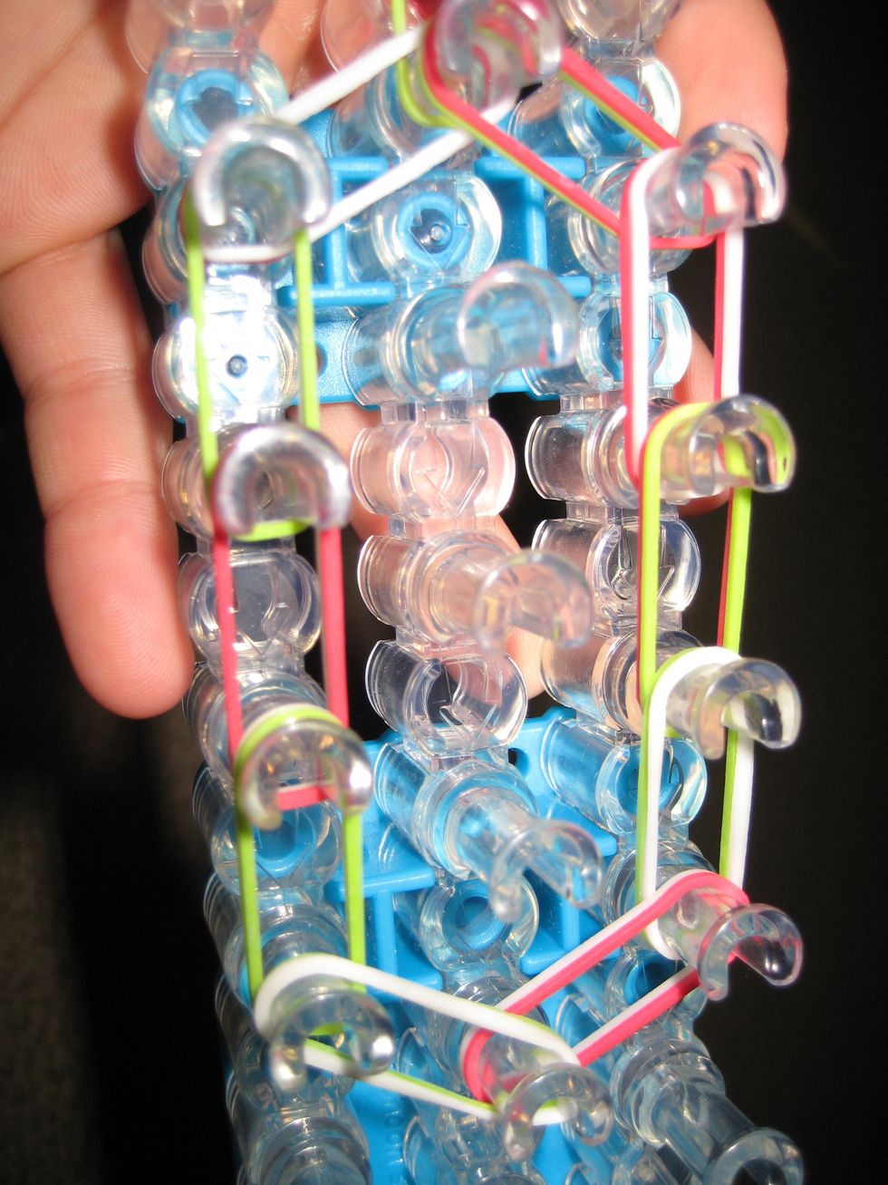 Close the end by going diagonally. This time do left first. Double the bands.