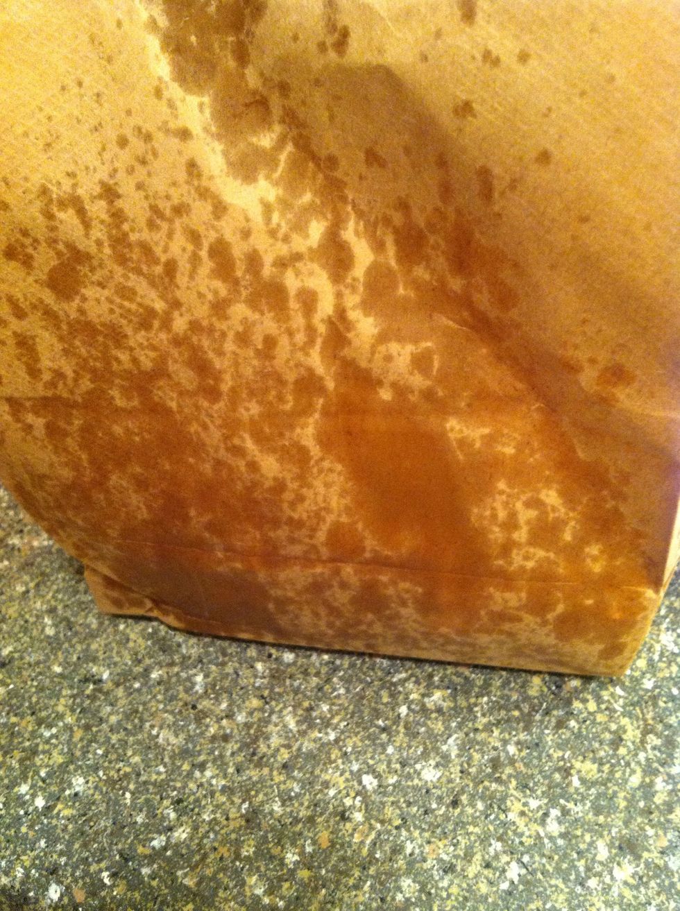 Close the fold and shake it vigorously. When the outside of the bag looks pretty covered with oil, check your popcorn and shake again if needed.