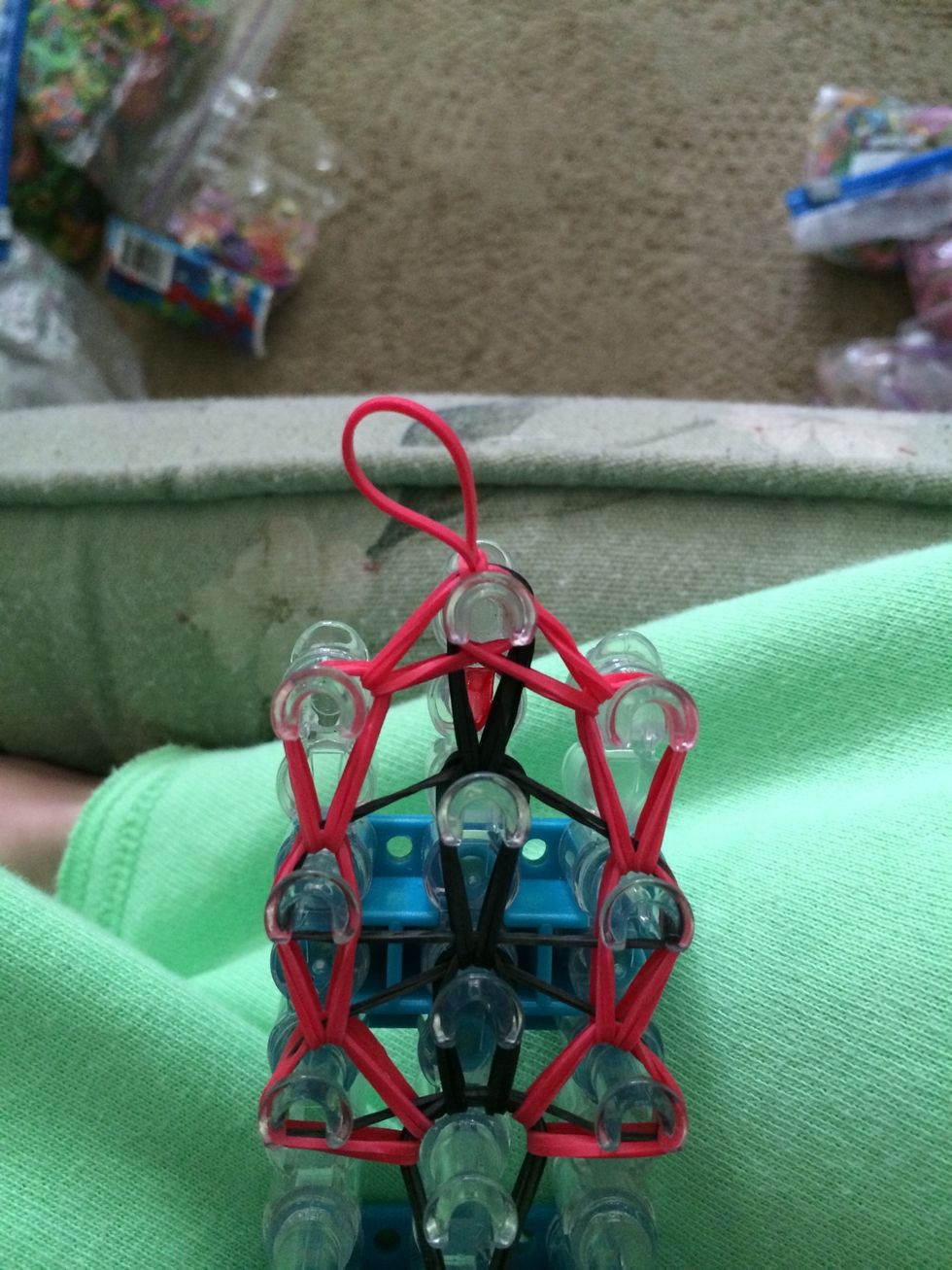 Close the slipknot and make sure that it is snug. With our slipknot in place now it's time to take our tie off loom.