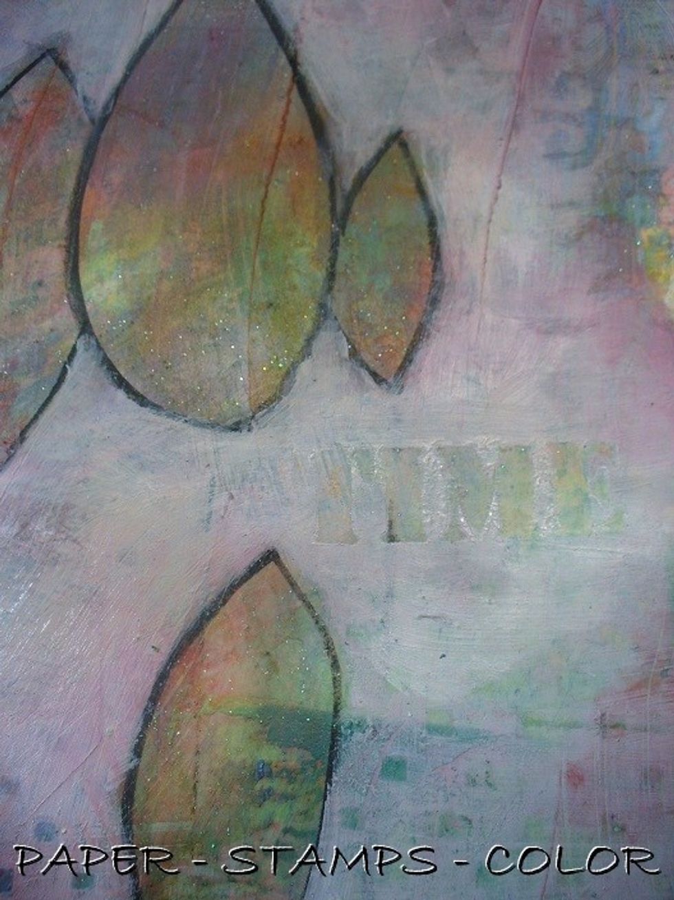 Close up of a part where I've used the tick-tock stencil to remove some of the gesso.