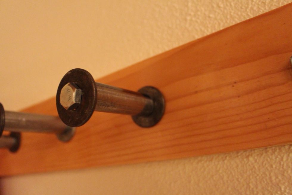 Close up of peg. I used 3 inch tube, so when it stuck out from the wall it was around 5 ish inches. You want to make sure your pegs are a good length especially if behind a door.