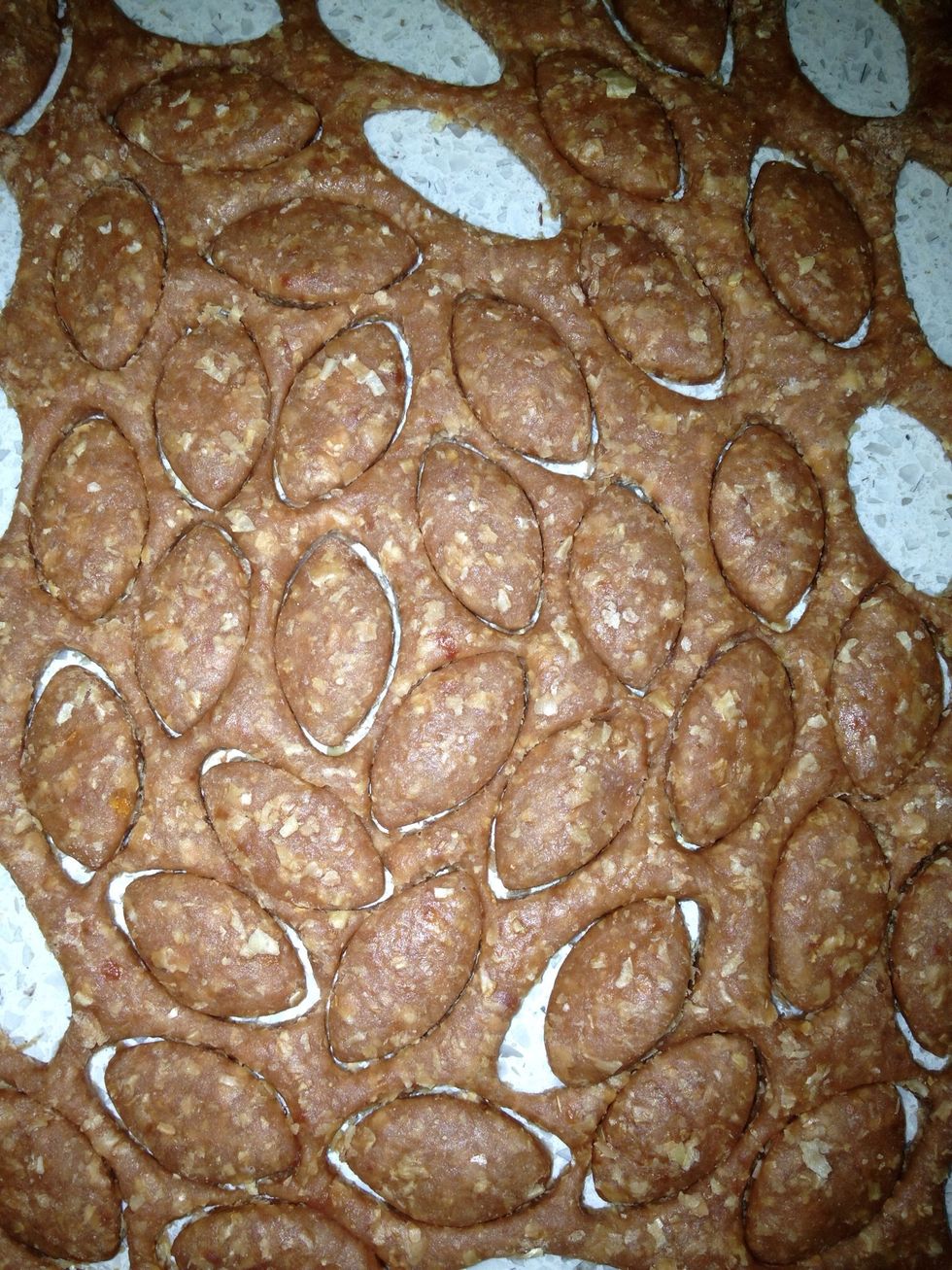 Close-up of the dough being cut.