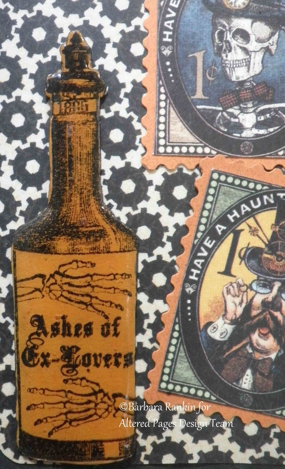 Closeup of fussy cut Sin City Stamps potion bottle, inked with orange ink, covered with Crystal Lacquer.