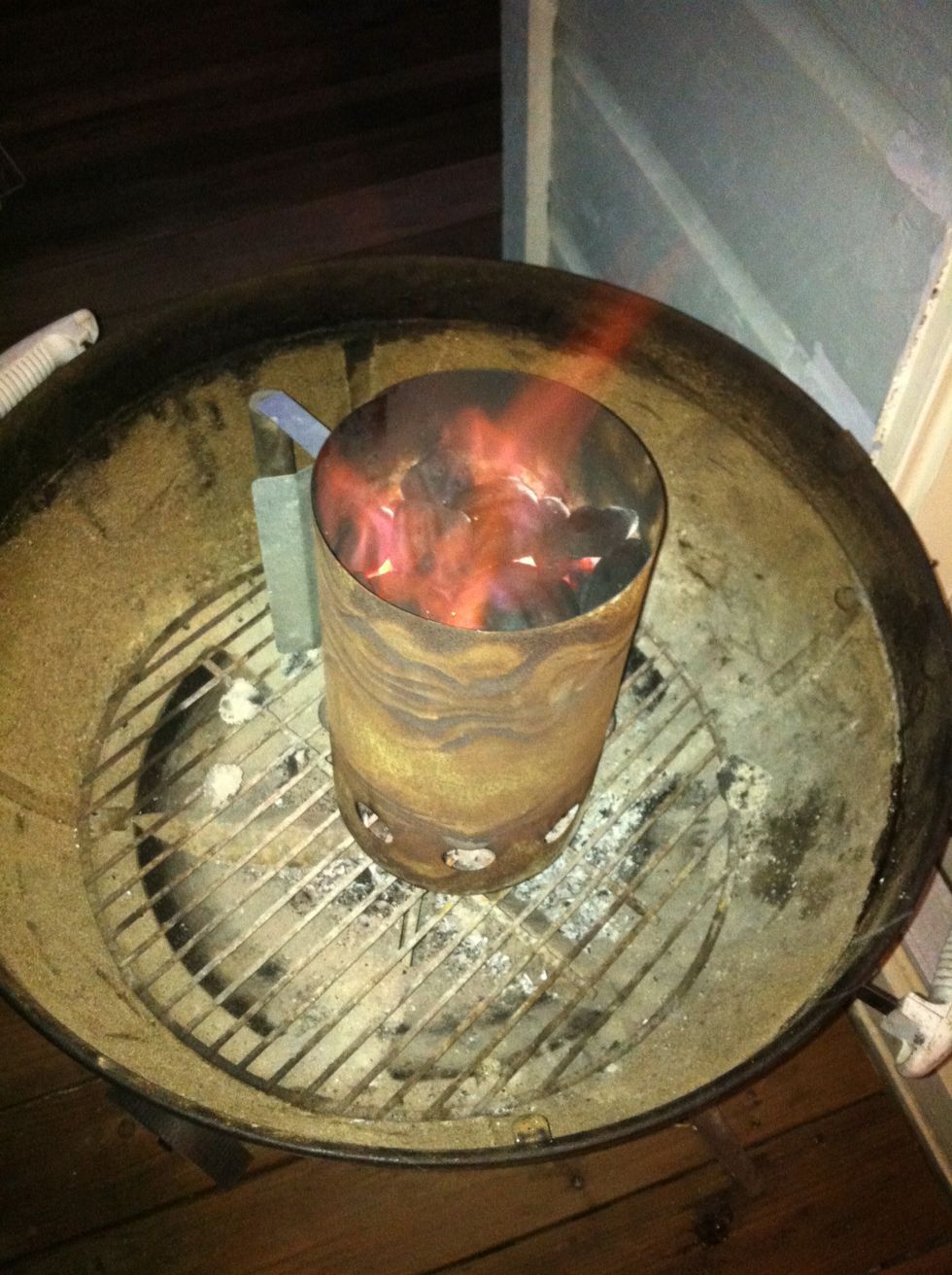 Coals should be glowing red and covered in ash. This takes about 15 - 20 minutes. Keep a close eye on them for the first few minutes, and add more paper if they do not appear to be lighting.