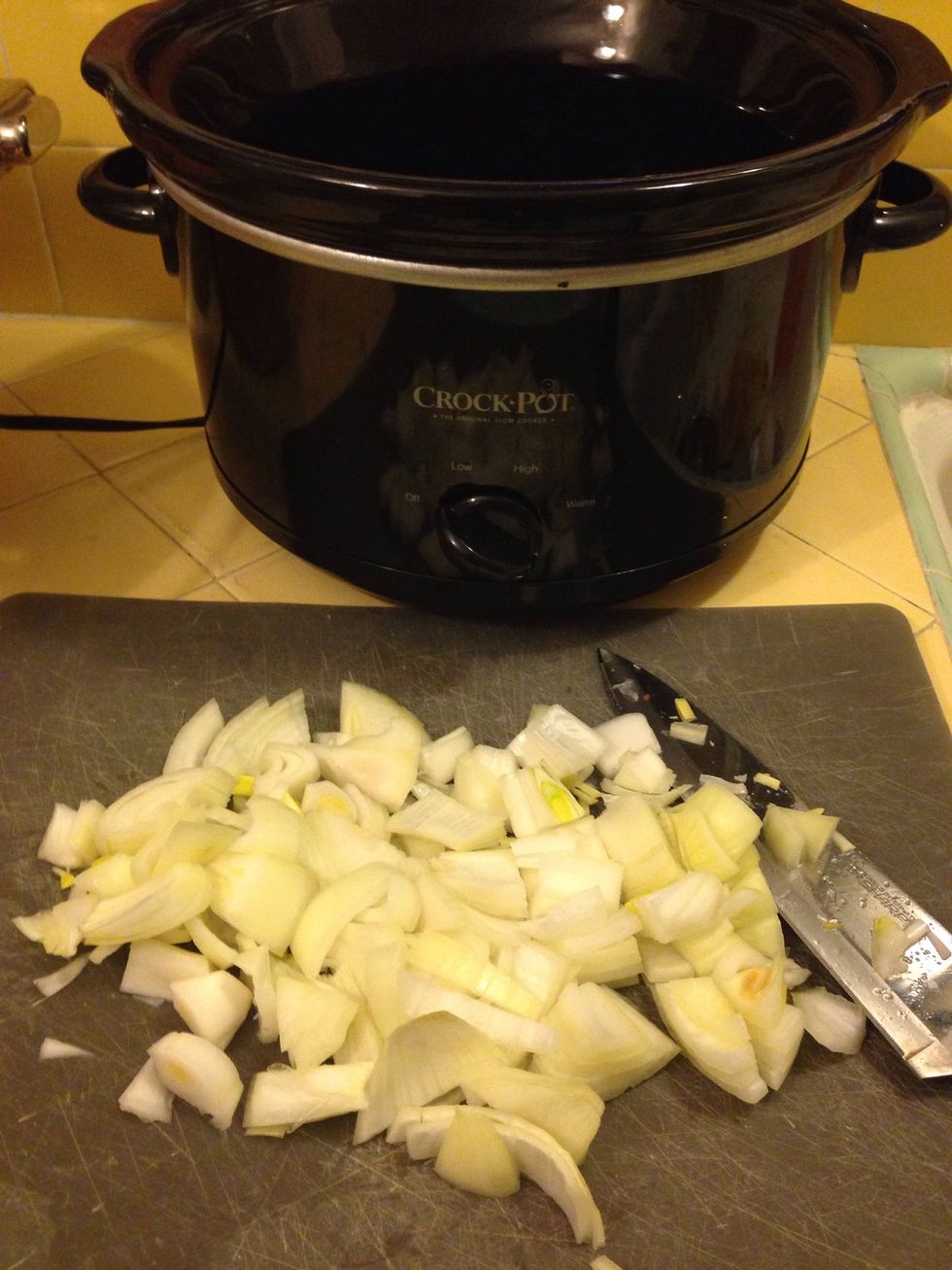 Coarsely chop an onion and add it to large crockpot