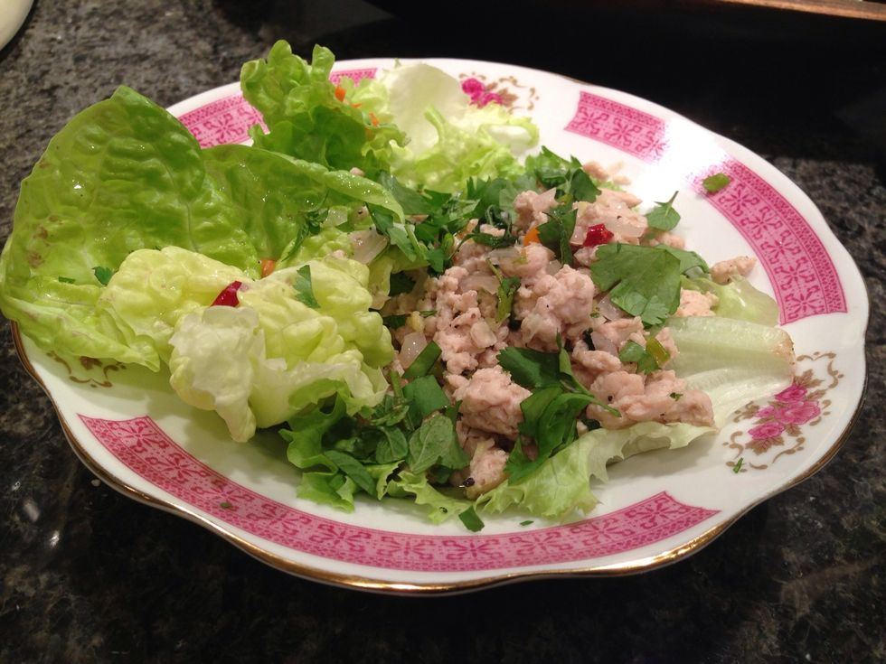 Coarsely chop lettuce, plate. Add chicken, spices and dress with lime juice mix. Serve!