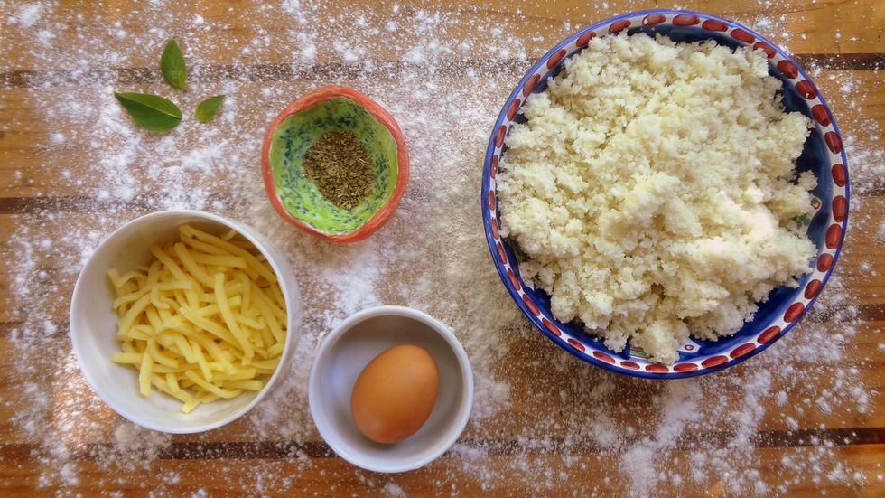 Coarsely chop the cauliflower. Place in a food processor and blend until it's the texture of fine rice (don't over blend, it will turn into pur\u00e9e). If using frozen cauliflower squeeze out excess water