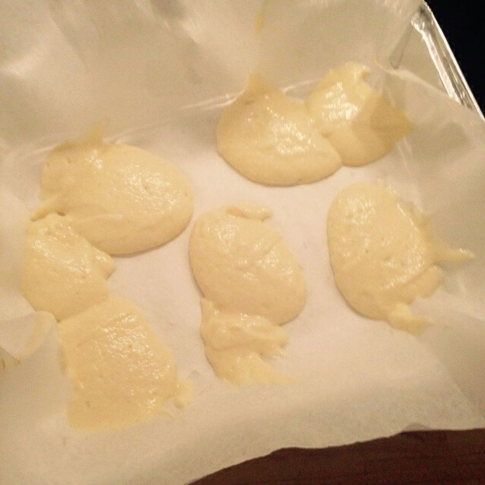 Coat a baking tray with wax paper. Start by scooping the ricotta mix randomly