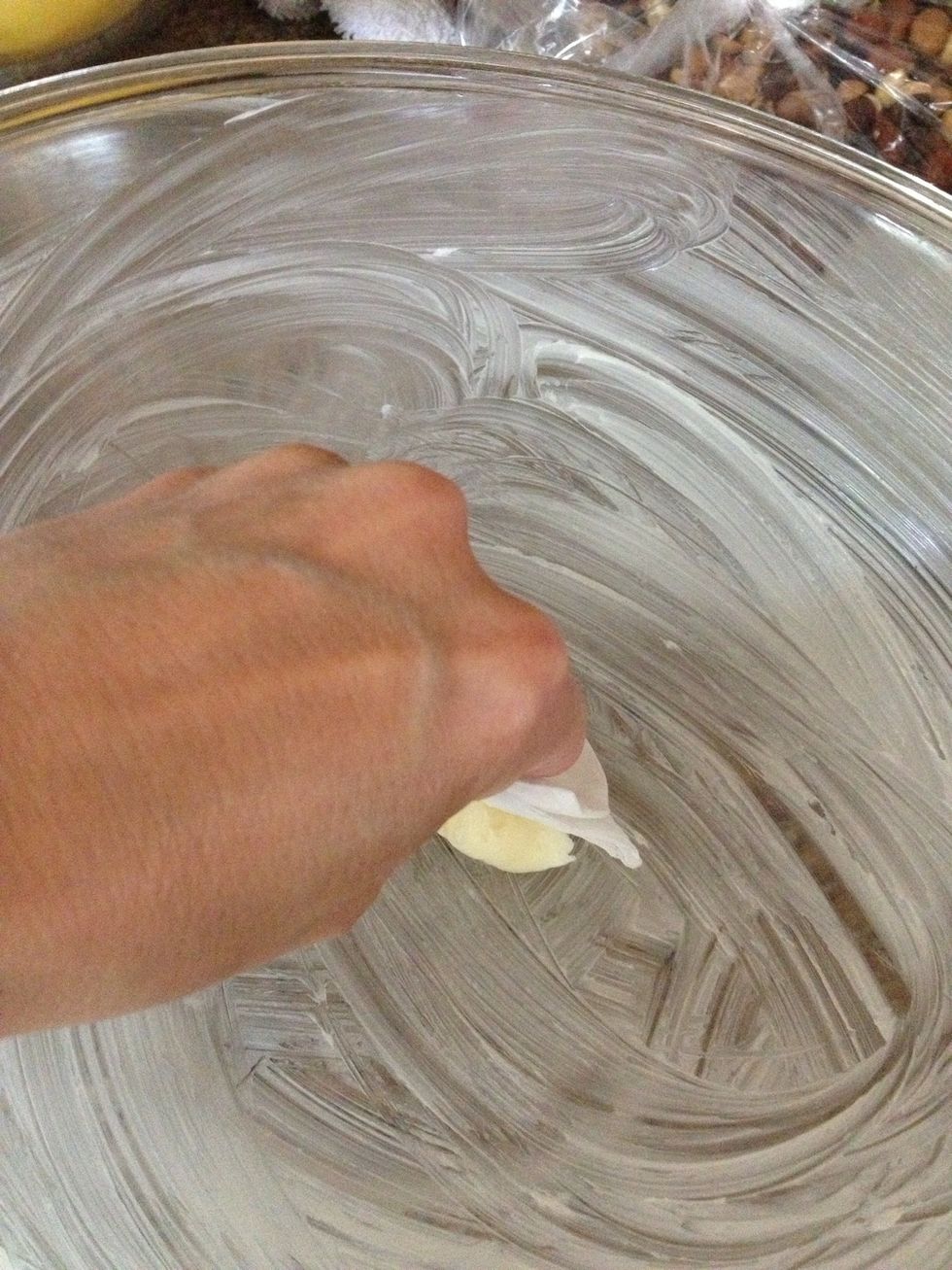 Coat a big bowl with butter so the marshmallows won't stick to it.