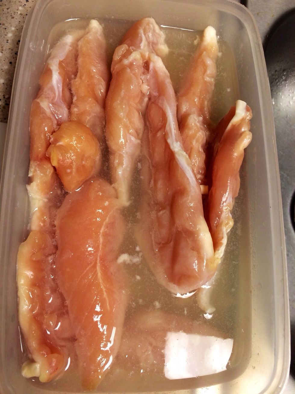 Coat chicken in lemon juice. I soaked frozen tenders in lemon juice and water, and left them the the frig overnight.