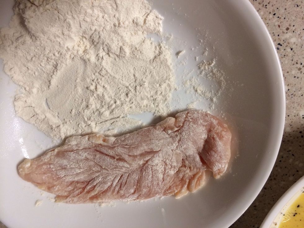 Coat chicken with flour