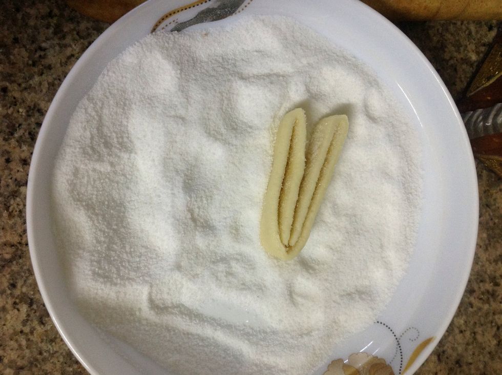 Coat each cut side with sugar.