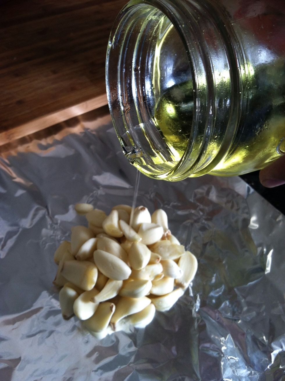 Coat garlic in oil