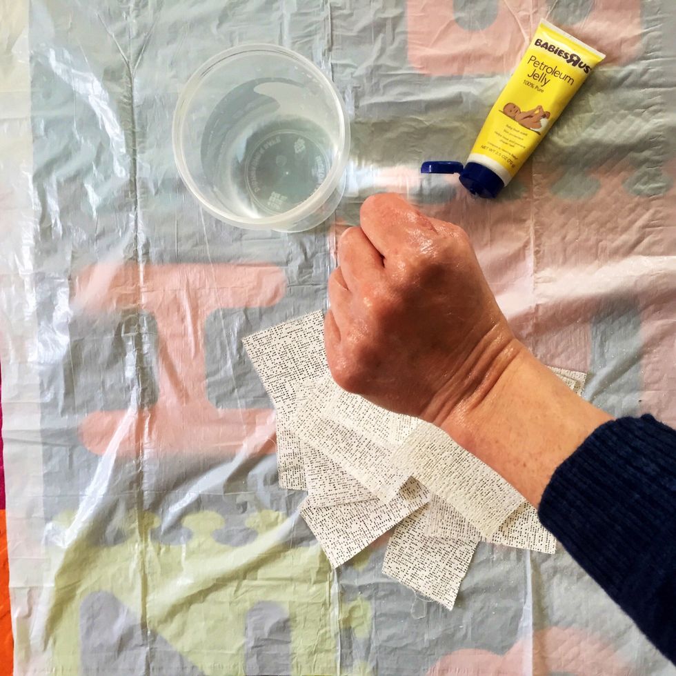 Coat non-dominant hand in lotion or Vaseline
