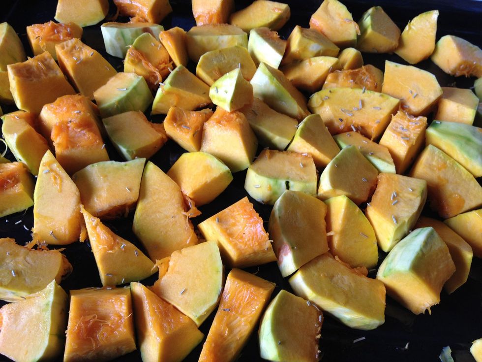 Coat pumpkin with olive oil, thyme, basil, oregano, salt and pepper. Bake for about 20 minutes, until the surface of the pumpkin turns slight brown.